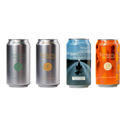 Four craft cider and ginger beer cans from Brewers Orchard lined up on a white background, featuring core range of granny, rising sun, non alc adventure and ginger beer